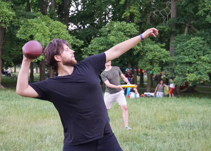 Throwing a football in the park